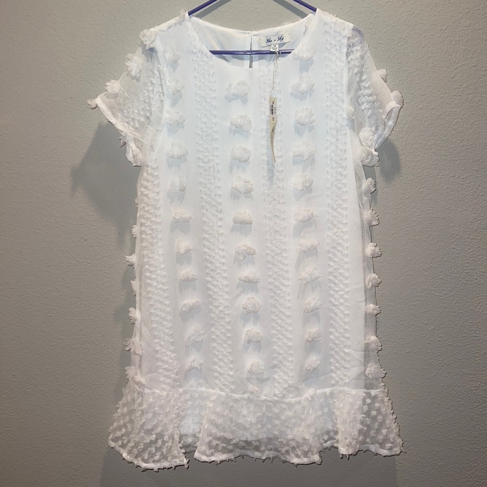 White dress with puff ball accents 🕊